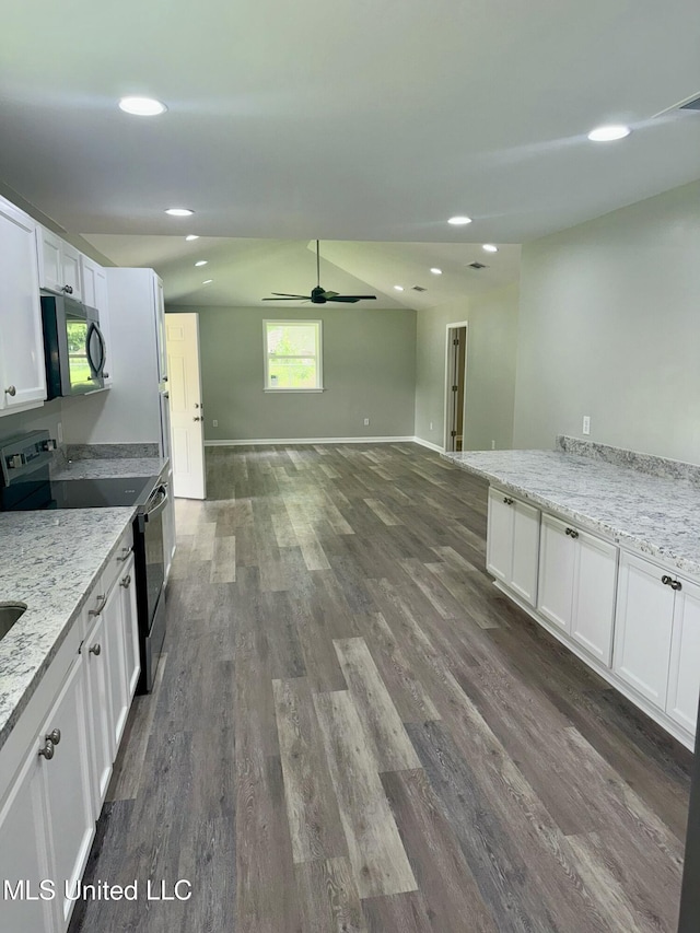 106 Edd Monk St, Mendenhall, MS 39114 - kitchen with stainless steel appliances, dark wood-style floors, white cabinets, light stone countertops, and recessed lighting