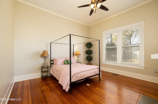 bedroom featuring ceiling fan, dark wood-type flooring, a textured ceiling, and ornamental molding