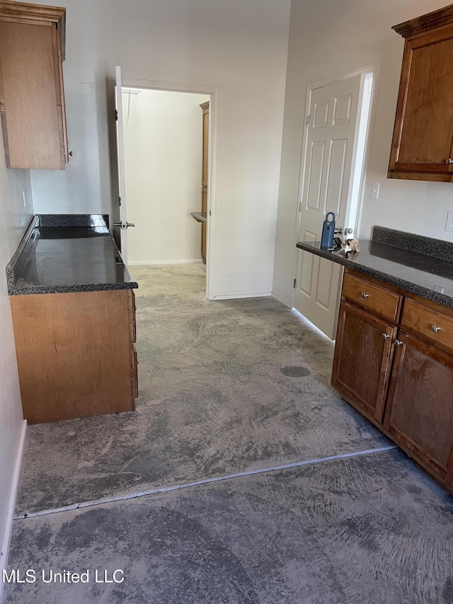 kitchen with dark colored carpet