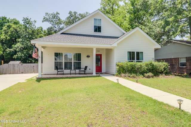 1709 S 1st St, Ocean Springs, MS 39564 - view of front facade with covered porch and roof with shingles