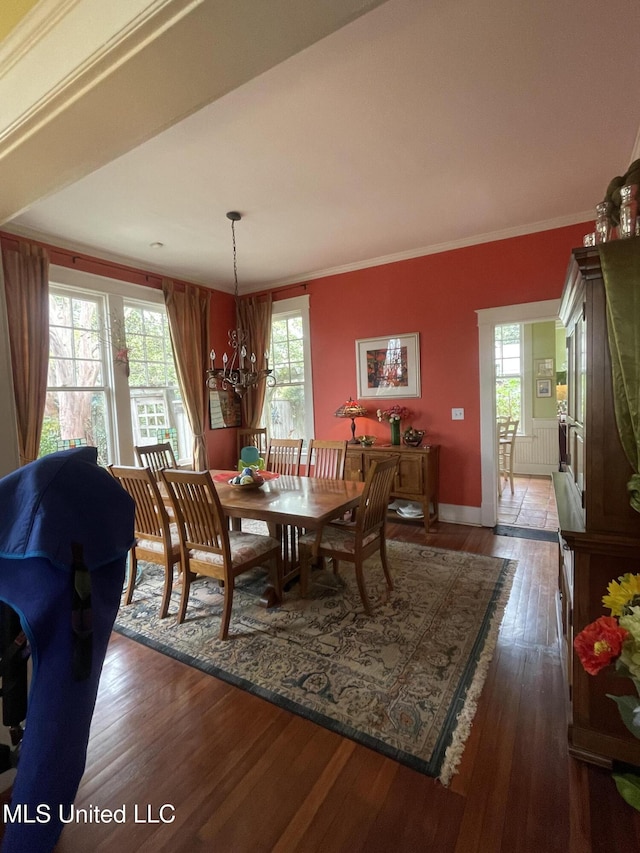 800 Gillespie St, Jackson, MS 39202 - dining space featuring hardwood / wood-style floors, ornamental molding, baseboards, and a chandelier