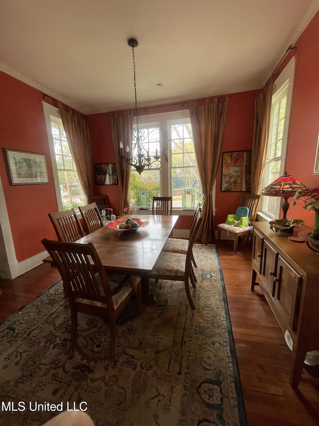 800 Gillespie St, Jackson, MS 39202 - dining space featuring wood finished floors, a chandelier, and baseboards