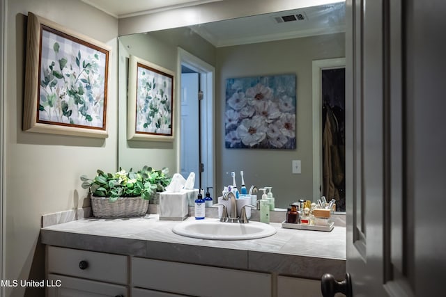 bathroom featuring vanity and ornamental molding