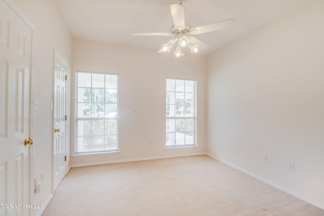 696 Aukai Pl, Diamondhead, MS 39525 - unfurnished room featuring light colored carpet, a ceiling fan, and baseboards