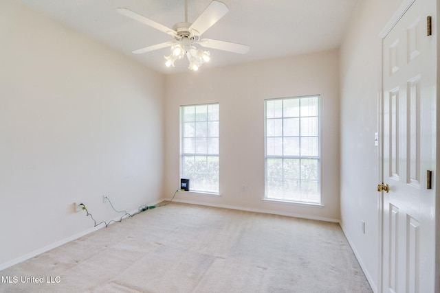 696 Aukai Pl, Diamondhead, MS 39525 - empty room with light carpet, ceiling fan, and baseboards
