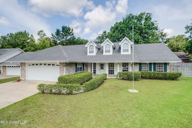 696 Aukai Pl, Diamondhead, MS 39525 - new england style home with brick siding, roof with shingles, an attached garage, and driveway