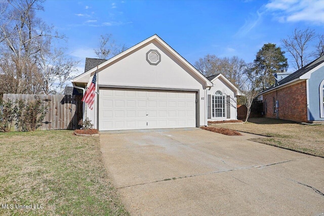 view of front of house featuring a garage and a front yard