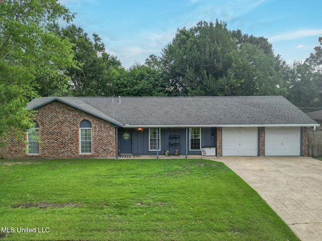 730 Holly Hills Dr, Biloxi, MS 39532 - ranch-style house featuring an attached garage, a front yard, concrete driveway, brick siding, and roof with shingles