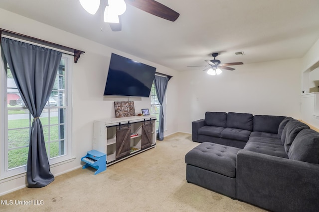 730 Holly Hills Dr, Biloxi, MS 39532 - living room featuring ceiling fan, light carpet, and healthy amount of natural light