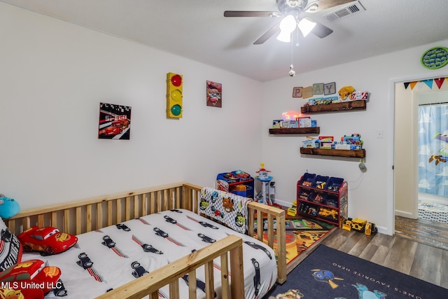 730 Holly Hills Dr, Biloxi, MS 39532 - bedroom featuring wood finished floors and a ceiling fan