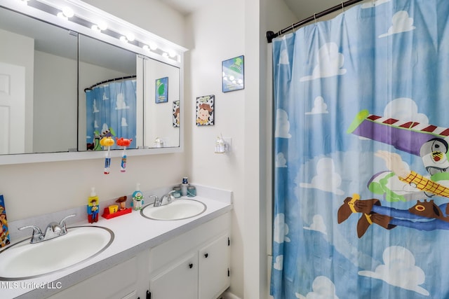 730 Holly Hills Dr, Biloxi, MS 39532 - bathroom featuring double vanity and a shower with curtain