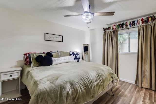 730 Holly Hills Dr, Biloxi, MS 39532 - bedroom with wood finished floors and a ceiling fan