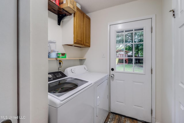 730 Holly Hills Dr, Biloxi, MS 39532 - laundry room with washing machine and dryer, cabinet space, and dark wood-style flooring