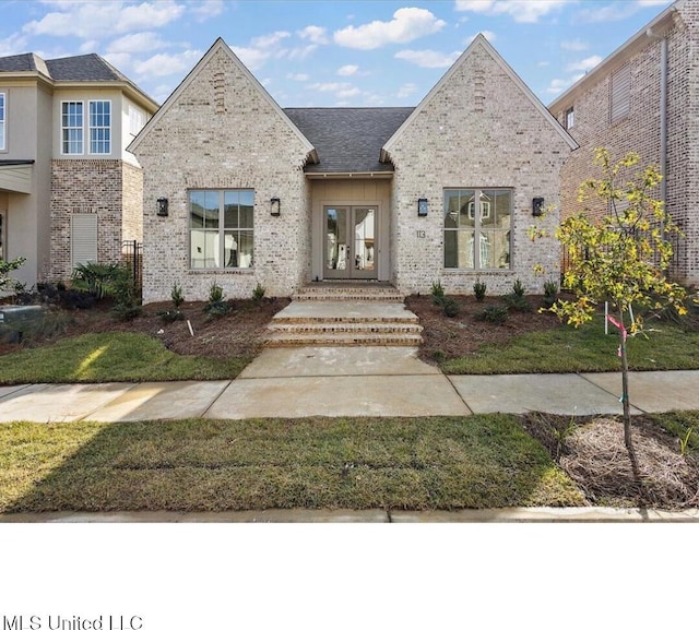 113 Water St, Madison, MS 39110 - view of front of house with french doors and brick siding
