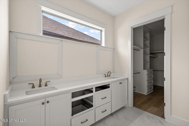 113 Water St, Madison, MS 39110 - full bathroom with double vanity, marble finish flooring, and toilet