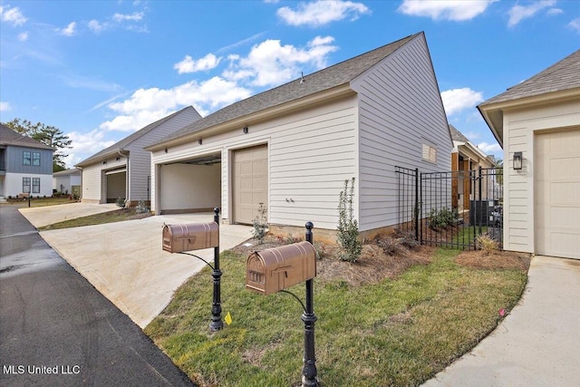 113 Water St, Madison, MS 39110 - view of side of home featuring concrete driveway, central AC unit, and fence