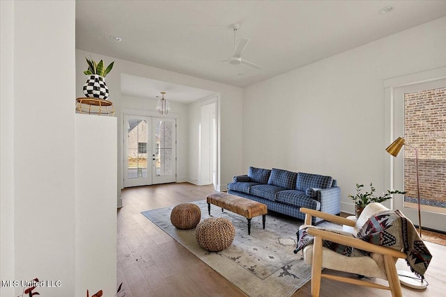 113 Water St, Madison, MS 39110 - living area with wood finished floors, french doors, ceiling fan, and baseboards
