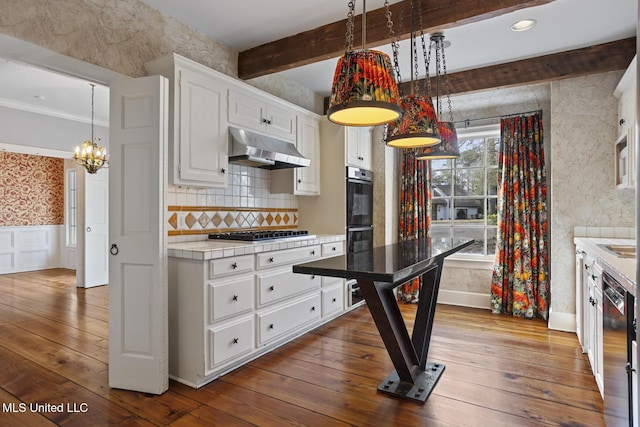 kitchen featuring gas cooktop, beam ceiling, black dishwasher, wood-type flooring, and white cabinets