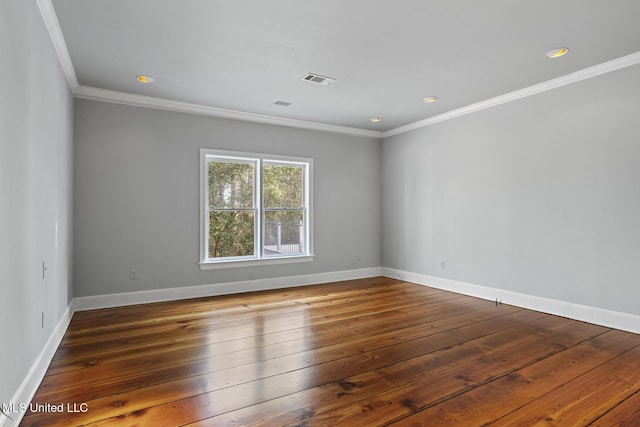 unfurnished room featuring crown molding and dark hardwood / wood-style floors