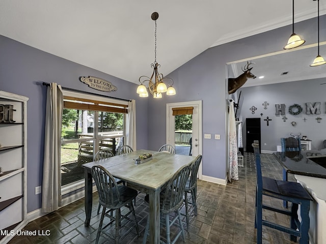 214 Terrapin Creek Rd, Brandon, MS 39042 - dining room featuring brick flooring, baseboards, vaulted ceiling, a barn door, and a chandelier