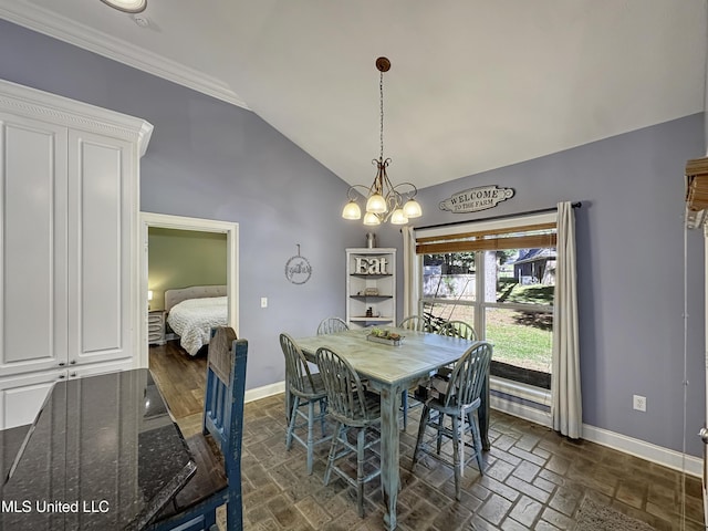 214 Terrapin Creek Rd, Brandon, MS 39042 - dining area featuring baseboards, vaulted ceiling, a chandelier, and ornamental molding