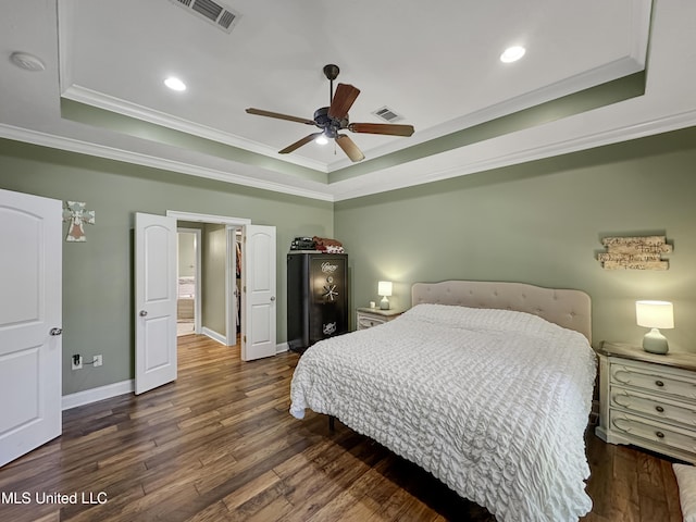 214 Terrapin Creek Rd, Brandon, MS 39042 - bedroom featuring a tray ceiling, ornamental molding, dark wood-style flooring, baseboards, and recessed lighting