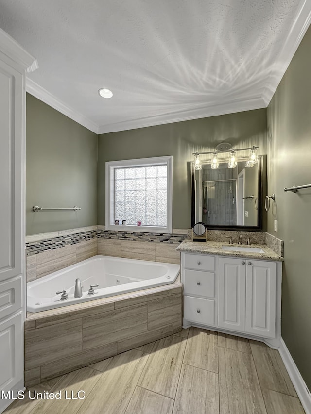 214 Terrapin Creek Rd, Brandon, MS 39042 - full bathroom with a whirlpool tub, vanity, a shower stall, ornamental molding, and wood finished floors