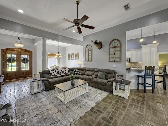 214 Terrapin Creek Rd, Brandon, MS 39042 - living room featuring a ceiling fan, a chandelier, french doors, brick floors, and ornamental molding