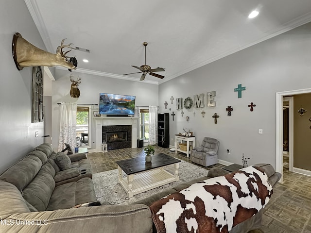 214 Terrapin Creek Rd, Brandon, MS 39042 - living area featuring stone tile floors, ceiling fan, crown molding, baseboards, and recessed lighting