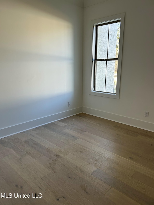 empty room with light wood-type flooring