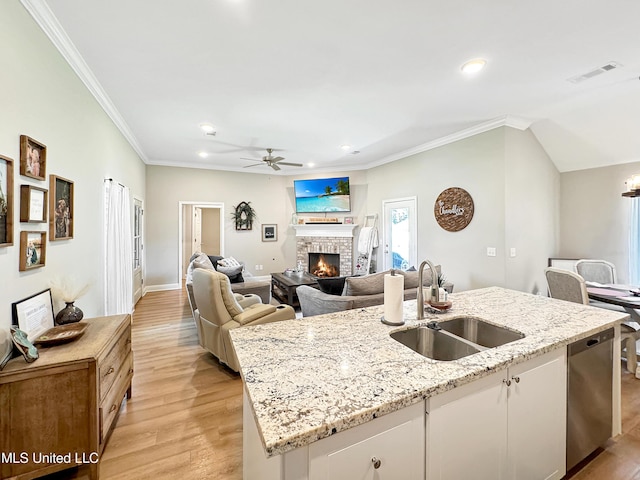 708 Silver Bnd, Pearl, MS 39208 - kitchen with dishwasher, ceiling fan, a lit fireplace, light wood-type flooring, and recessed lighting