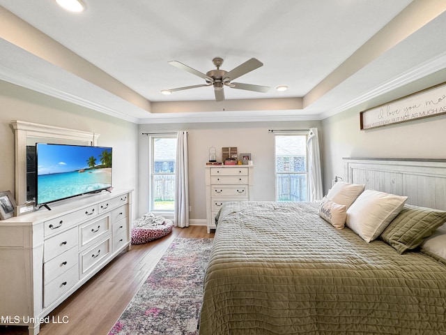 708 Silver Bnd, Pearl, MS 39208 - bedroom featuring a tray ceiling, multiple windows, light wood-type flooring, and recessed lighting