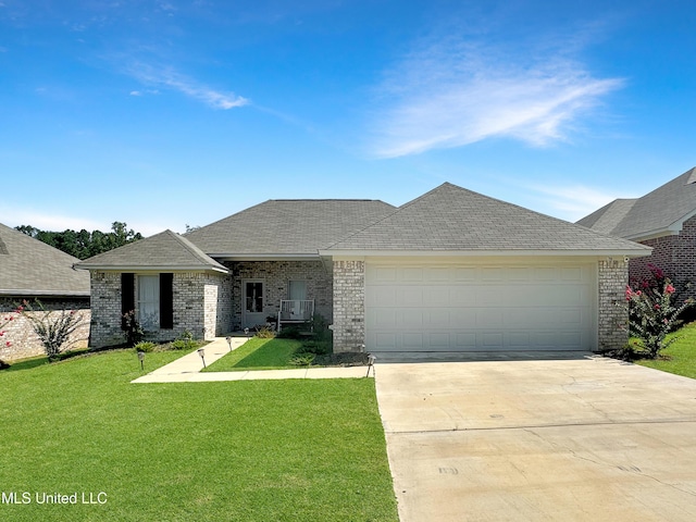 708 Silver Bnd, Pearl, MS 39208 - view of front facade featuring driveway, a front yard, a garage, and brick siding