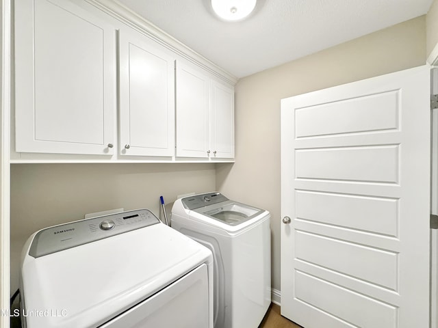 708 Silver Bnd, Pearl, MS 39208 - laundry room featuring cabinet space and washer and clothes dryer