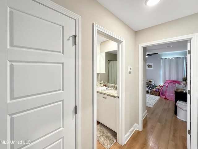 708 Silver Bnd, Pearl, MS 39208 - hallway with light wood finished floors and a sink