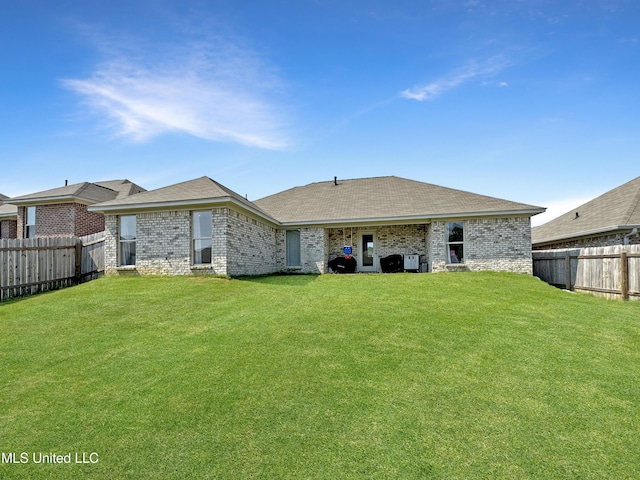 708 Silver Bnd, Pearl, MS 39208 - rear view of property featuring a fenced backyard, brick siding, and a shingled roof
