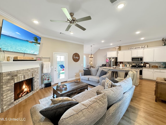 708 Silver Bnd, Pearl, MS 39208 - living area featuring ornamental molding, ceiling fan, a fireplace, recessed lighting, and light wood-type flooring