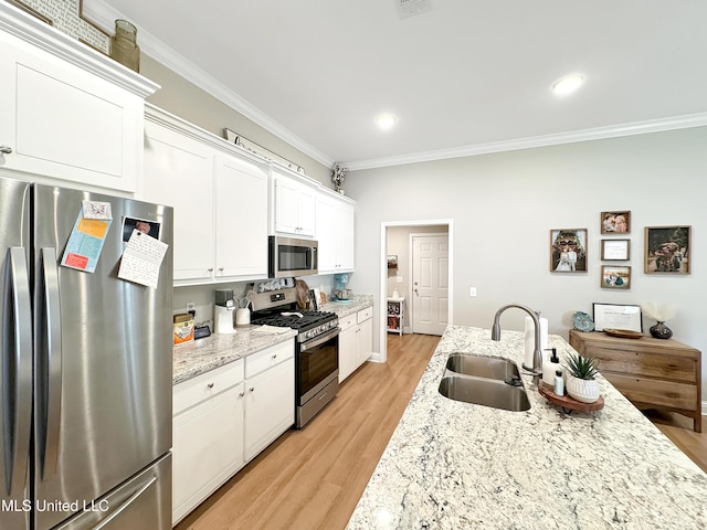 708 Silver Bnd, Pearl, MS 39208 - kitchen featuring appliances with stainless steel finishes, ornamental molding, white cabinetry, light wood-type flooring, and recessed lighting