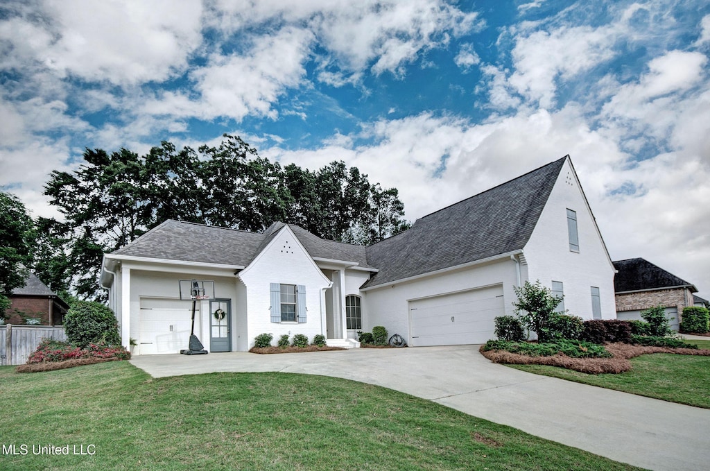112 Camden, Madison, MS 39110 - view of front of property with driveway, a shingled roof, and an attached garage