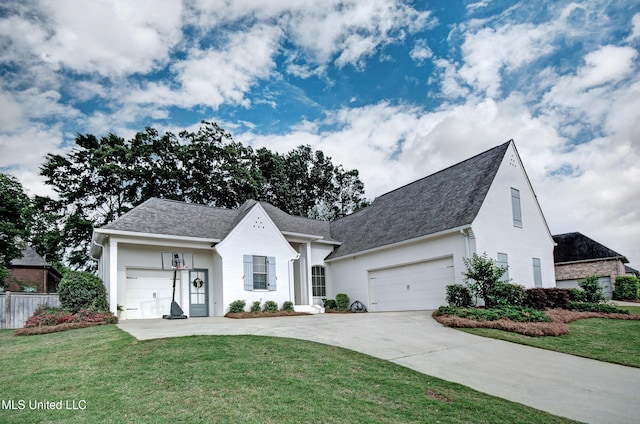 view of front of property with driveway, a shingled roof, and an attached garage