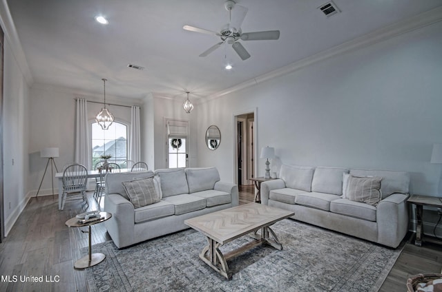 living area featuring crown molding, a ceiling fan, wood finished floors, recessed lighting, and baseboards