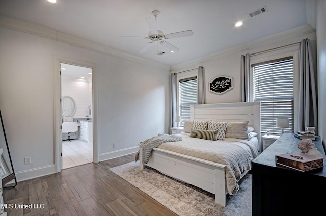 bedroom featuring hardwood / wood-style flooring, crown molding, baseboards, recessed lighting, and a ceiling fan
