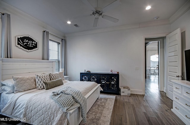 bedroom with multiple windows, crown molding, dark wood-type flooring, recessed lighting, and baseboards