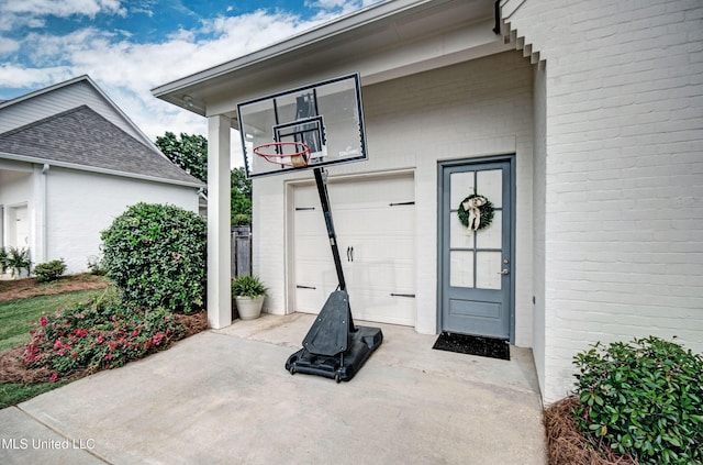 view of exterior entry with a garage