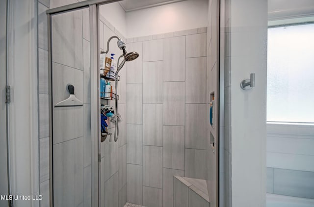 full bath featuring a shower stall