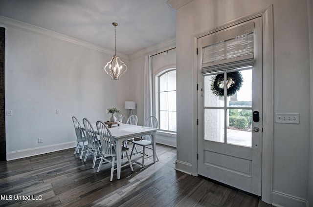 dining space featuring a chandelier, dark wood-type flooring, and baseboards