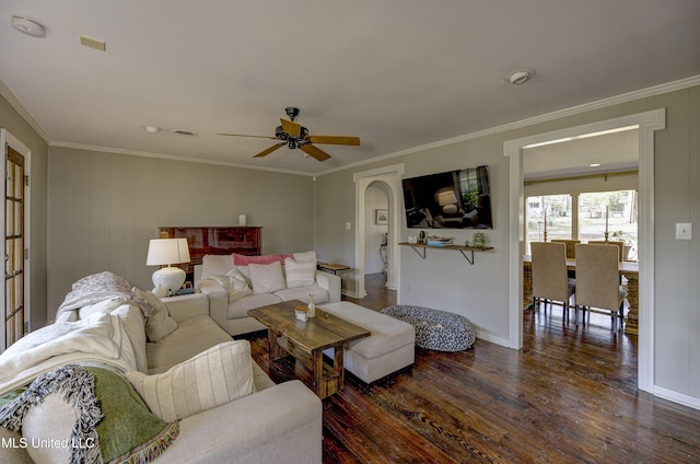 living room featuring crown molding, dark hardwood / wood-style floors, and ceiling fan