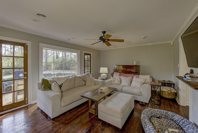 living room with crown molding, dark hardwood / wood-style floors, and ceiling fan