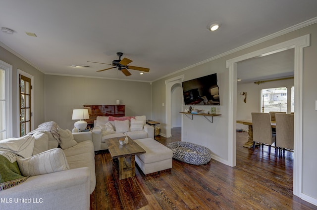 living room featuring ornamental molding and dark hardwood / wood-style floors