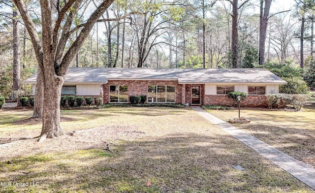 ranch-style home with a front yard